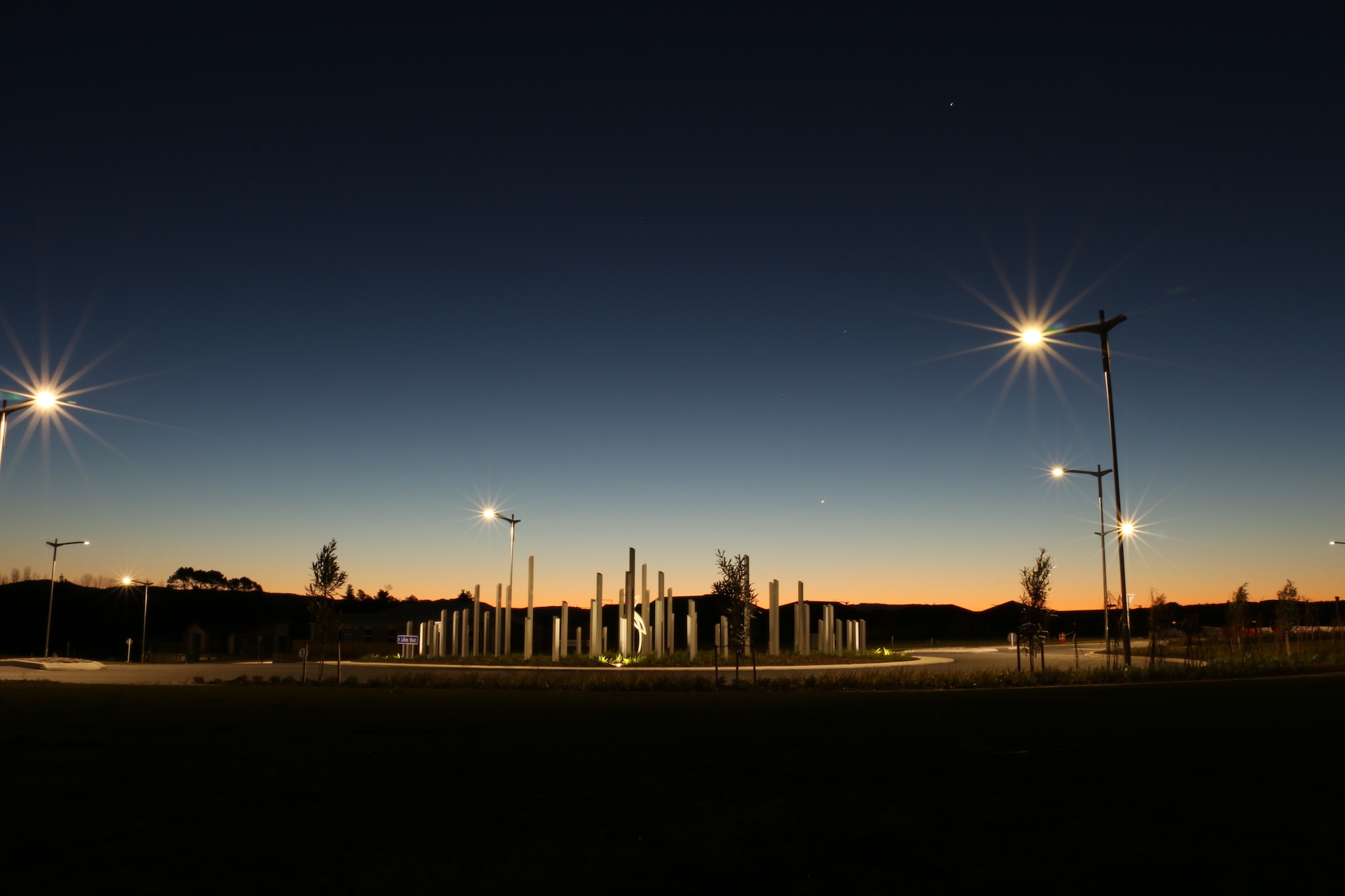 The Lakes roundabout at night illuminated by ibex lighting solutions.