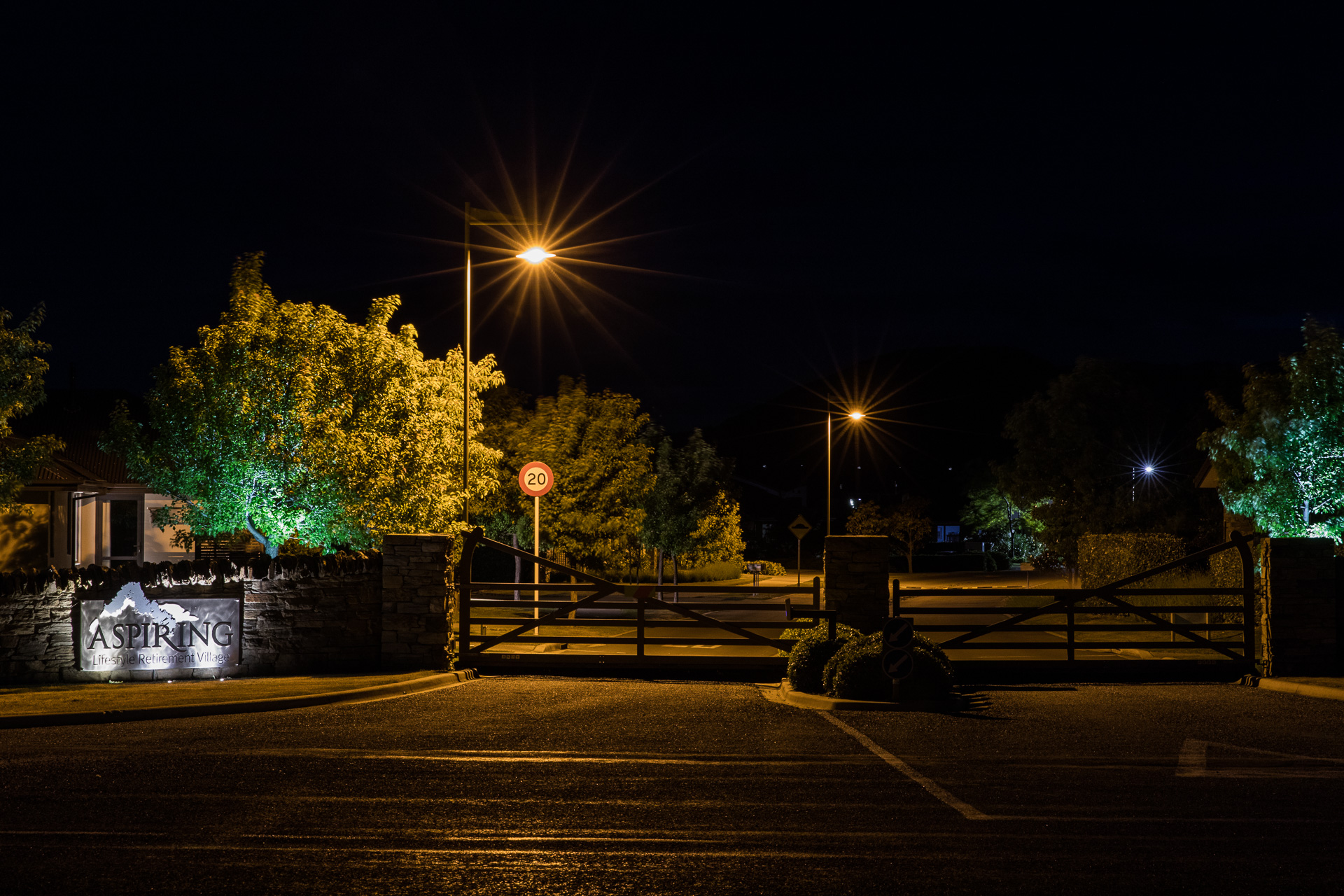 Aspiring retirement village gate at night illuminated by ibex lighting.