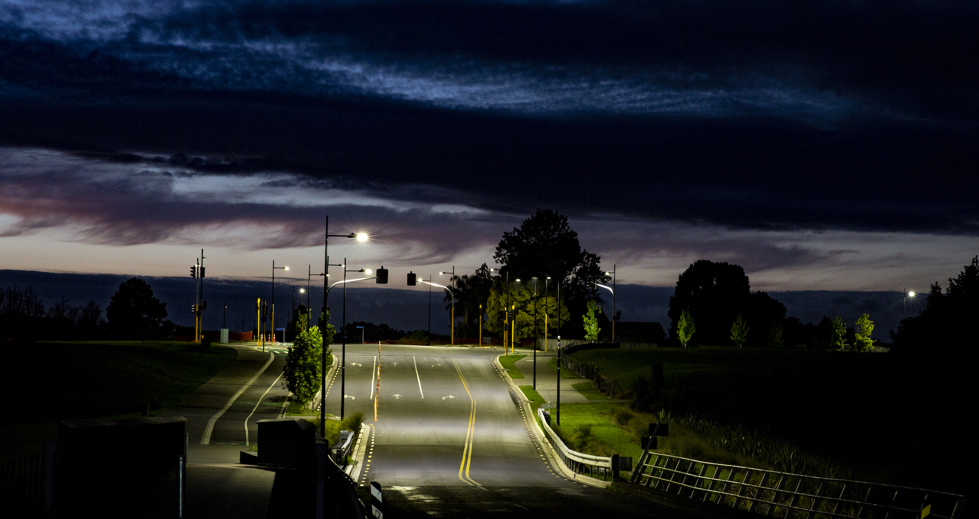 Auranga tree-lined street by night, presenting Ibex Lighting's lighting solution.