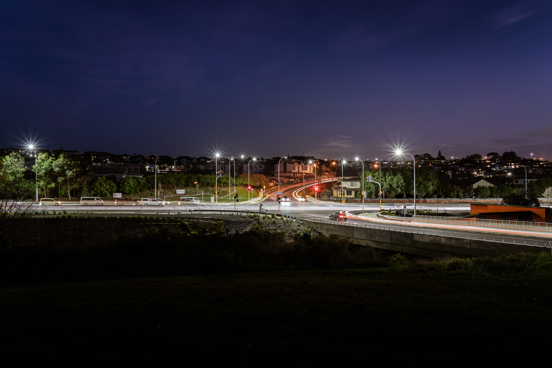 Medaillon Drive intersection at night illuminated by ibex lighting solutions.