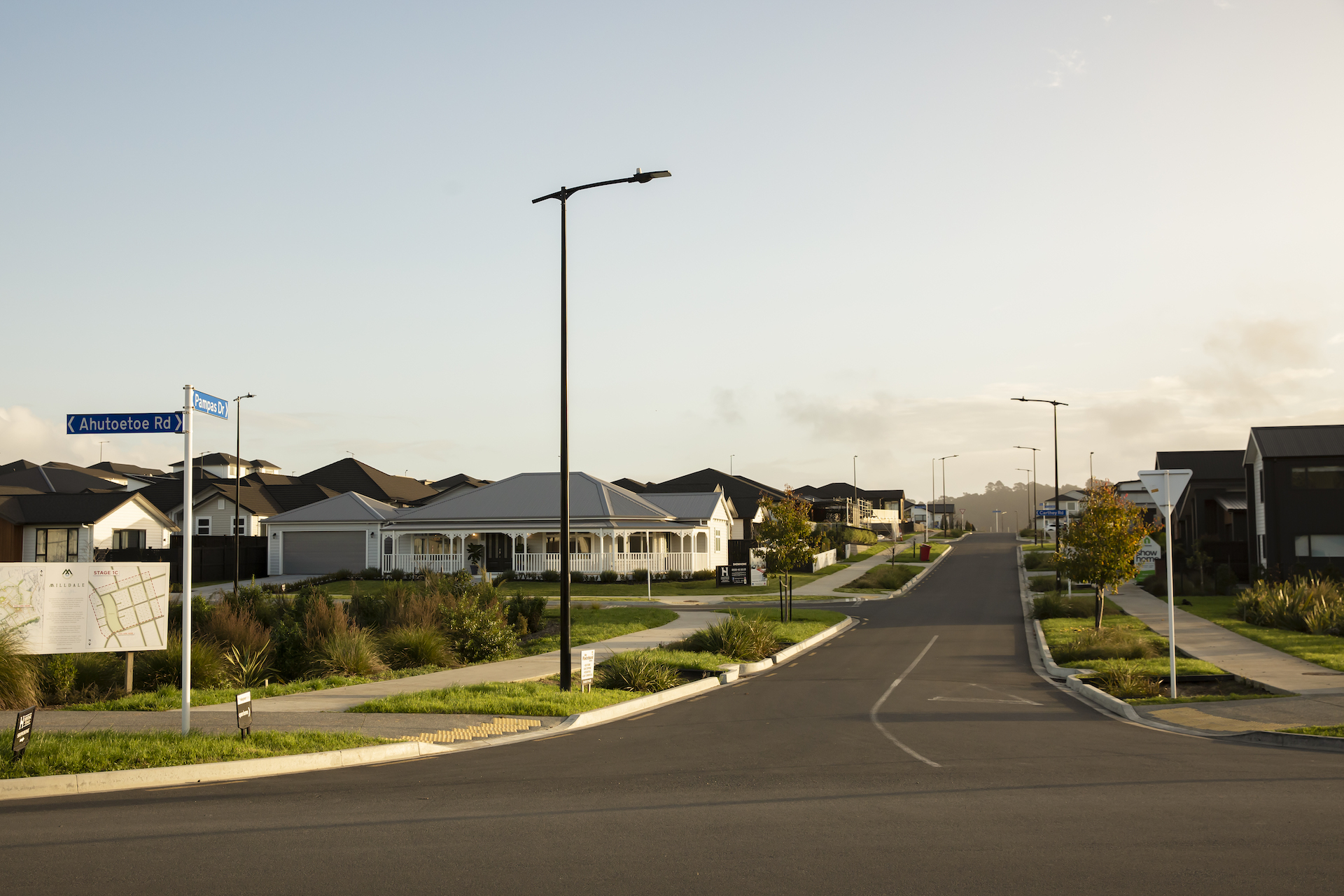 Milldale community road intersection illuminated by ibex lighting solutions.