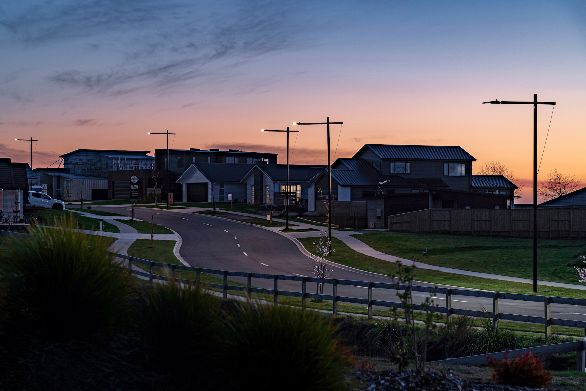 Ngā Roto Estate neighbourhood road at dusk illuminated by ibex lighting solutions.