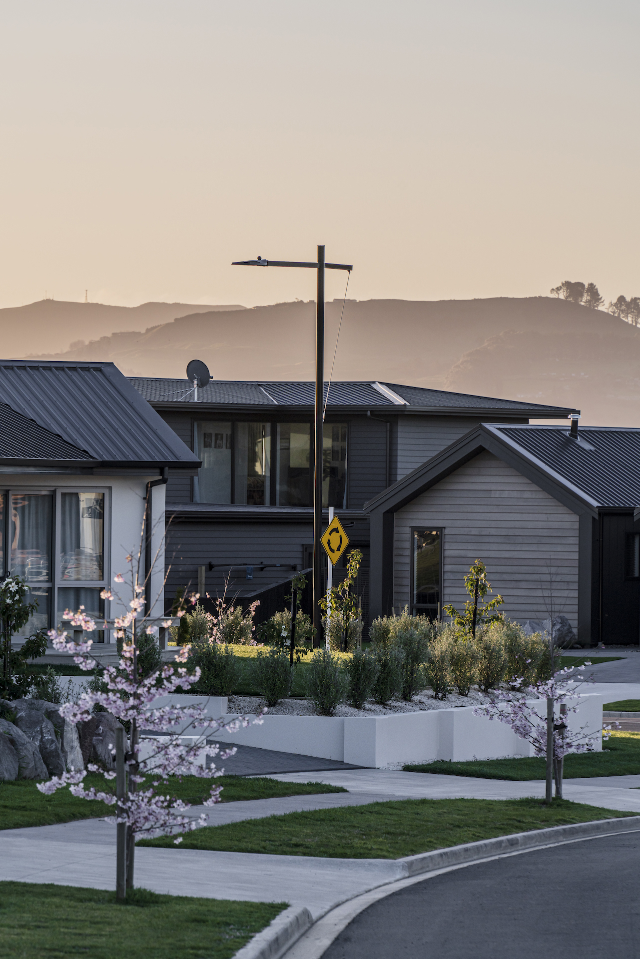 Riverton lighting pole installed in Ngā Roto Estate neighbourhood pathway illuminated by ibex lighting solutions.