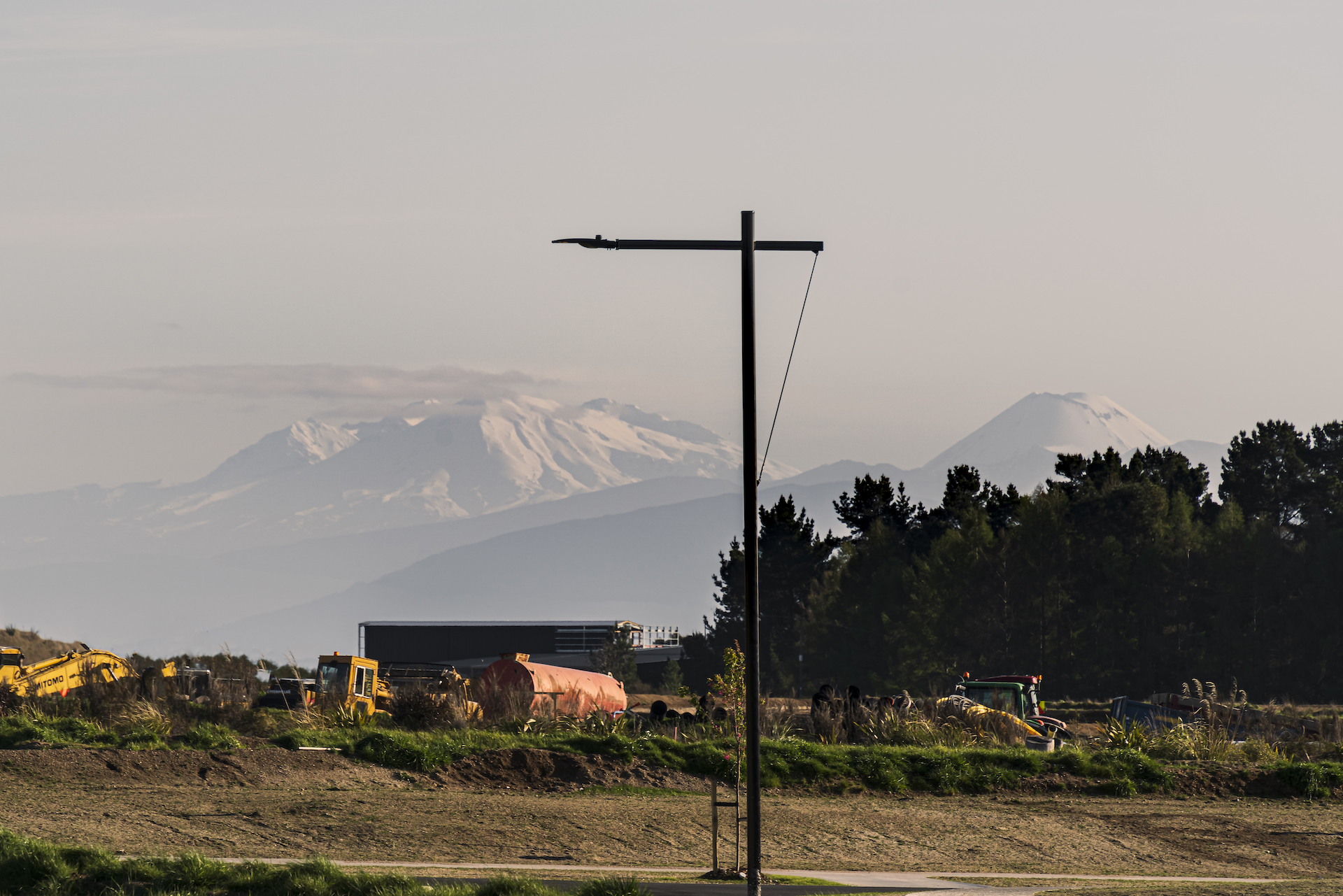 Riverton lighting pole in Ngā Roto Estate neighbourhood with mountain in the background illuminated by ibex lighting solutions.