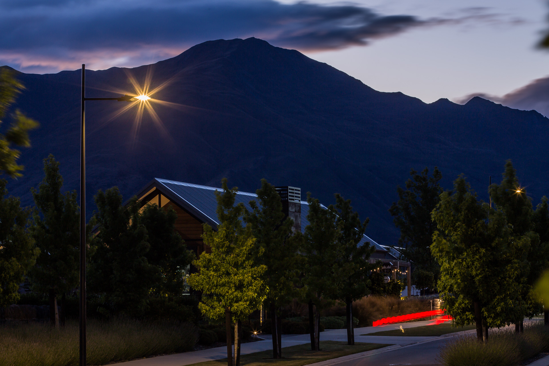 Northlake neighbourhood pathway at night illuminated by ibex lighting solutions with magnificent mountain in the background.
