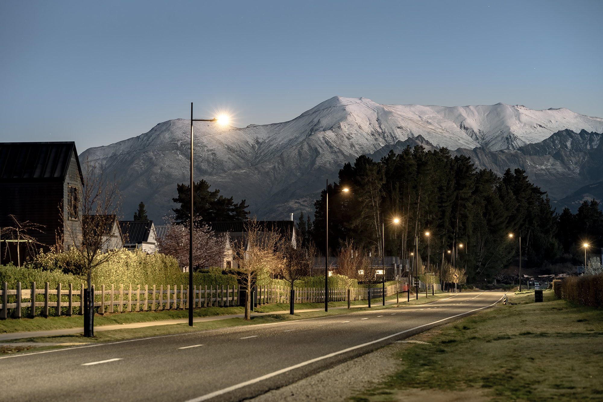Northlake road illuminated by ibex lighting solutions with magnificent mountain in the background.