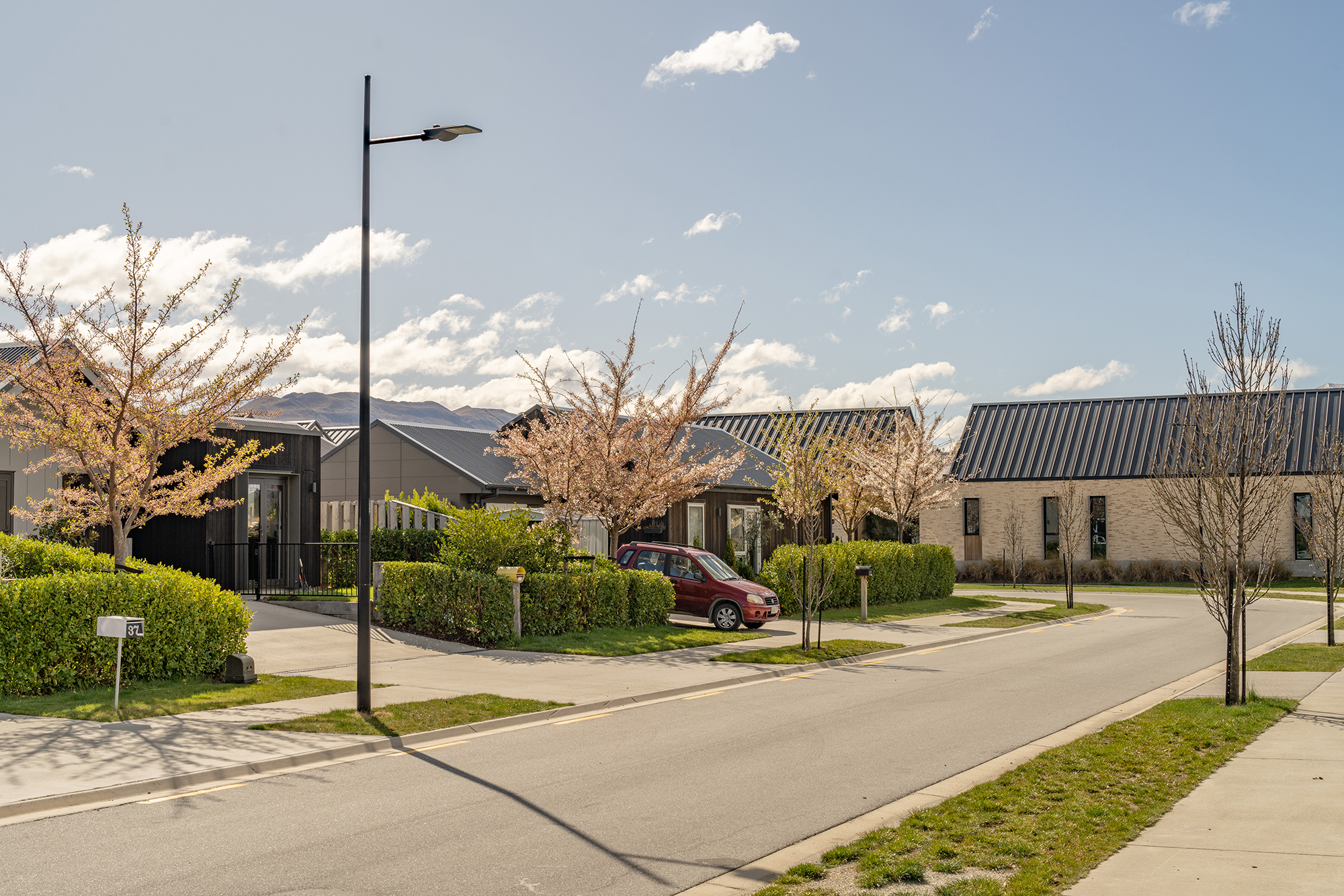 Northlake neighbourhood in spring illuminated by ibex lighting solutions with magnificent mountain in the background.