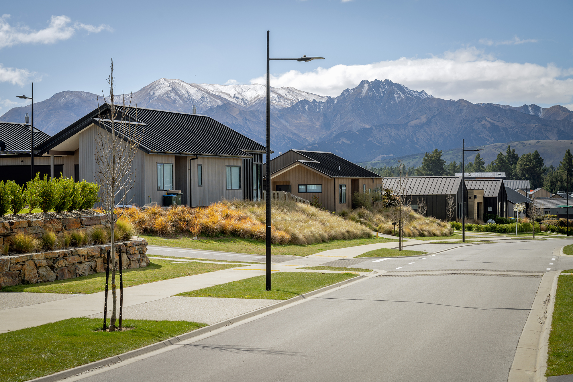 Northlake neighbourhood illuminated by ibex lighting solutions with magnificent mountain in the background.