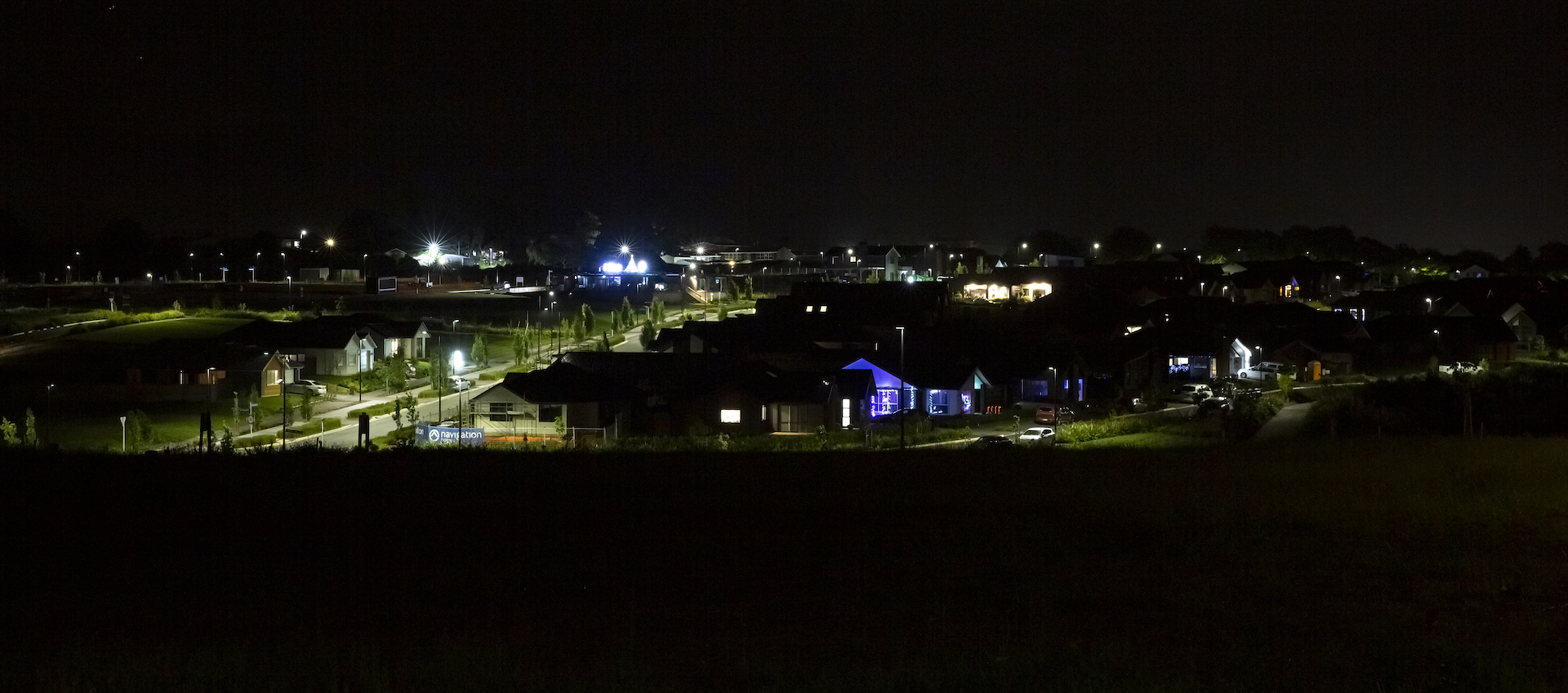 Paerata Rise neighbourhood overview at night illuminated by ibex lighting solutions.