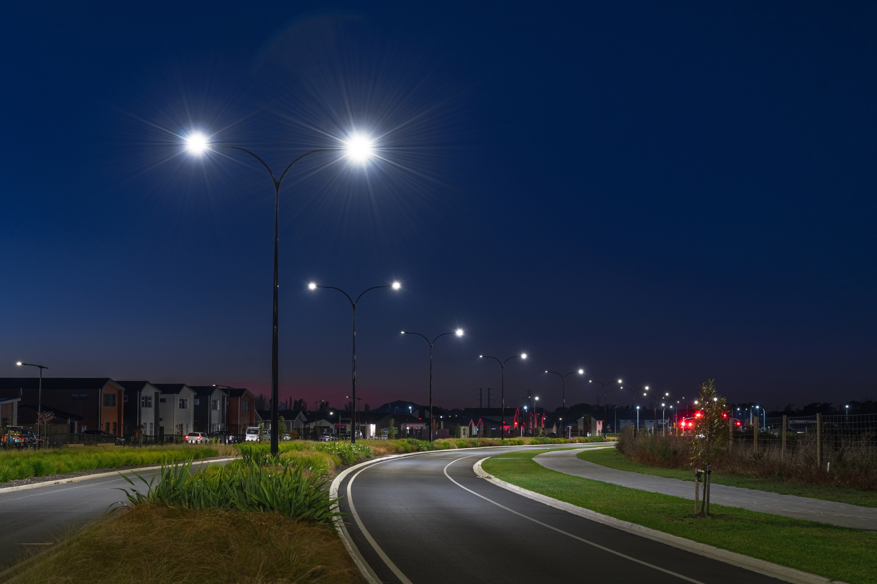 A residential road at night, illuminated by ibex Lighting.